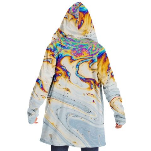 Back view of oil slick soap print cloak on model with hood up
