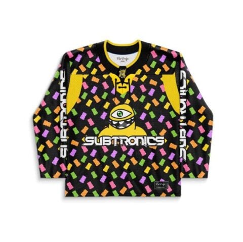 Front view of neon tossed candy pattern with one-eyed alien graphic, studio product setting
