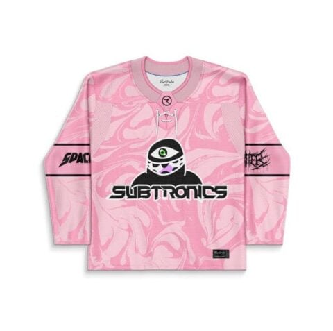 Pink abstract swirl hockey jersey front with one-eyed cartoon-style mascot and bold festival lettering